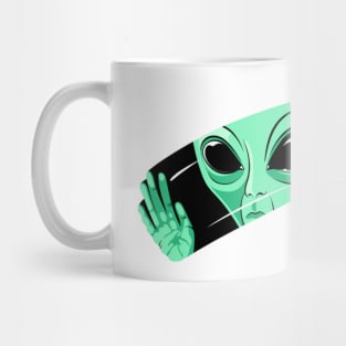 Green alien behind the glass Mug